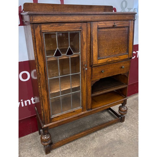 119 - An early 20th Century oak bureau bookcase