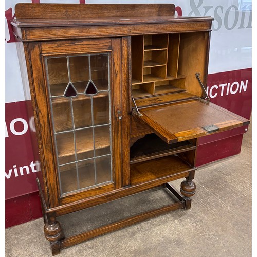 119 - An early 20th Century oak bureau bookcase