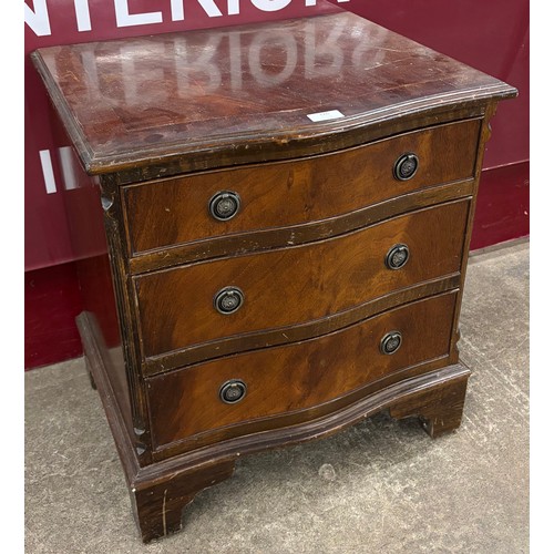 126 - A small George III style inlaid mahogany serpentine chest of drawers