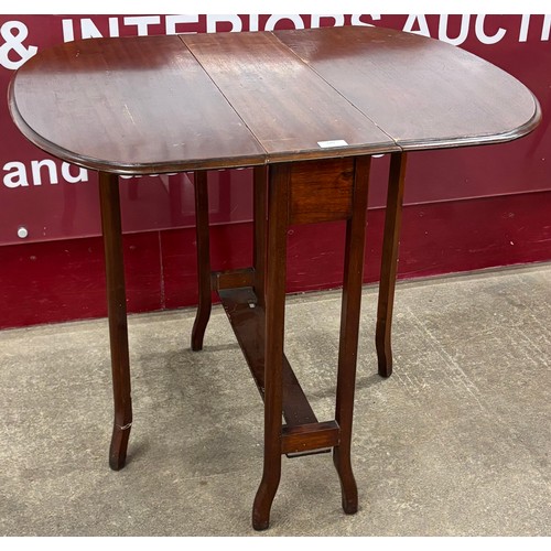 140 - An Edward VII mahogany Sutherland table