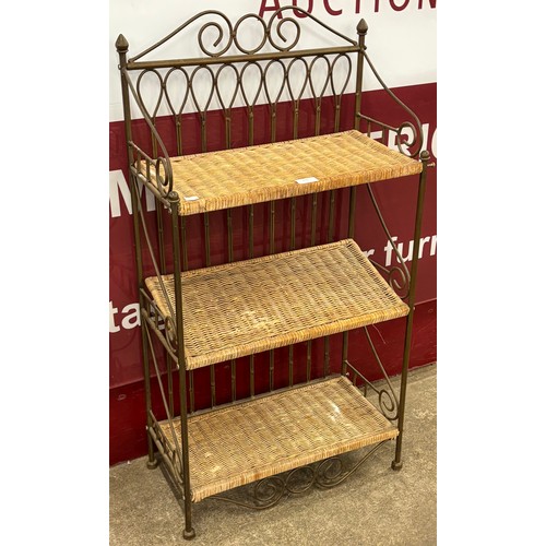 139 - An Italian style cast metal and wicker folding bookcase