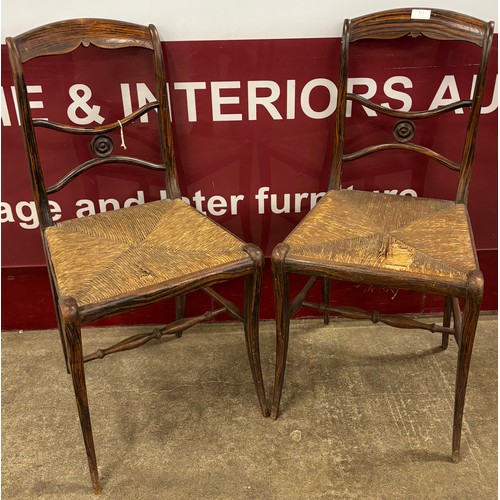 151 - A pair of Victorian simulated rosewood and rush seated side chairs