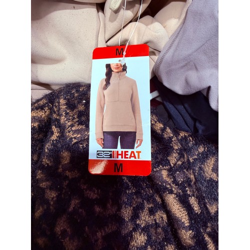 6136 - A pallet of mixed clothing to include trousers, shirts, underwear, coats, etc. various brands and si... 