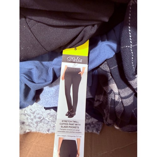 6136 - A pallet of mixed clothing to include trousers, shirts, underwear, coats, etc. various brands and si... 