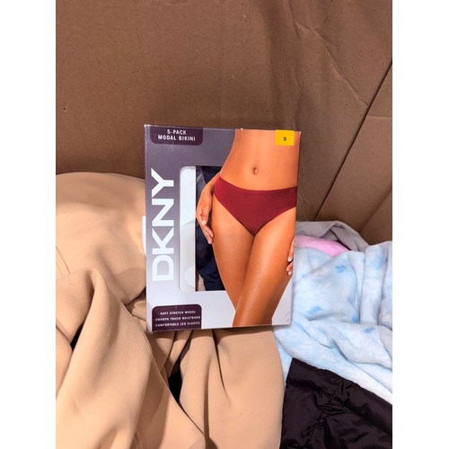 6136 - A pallet of mixed clothing to include trousers, shirts, underwear, coats, etc. various brands and si... 