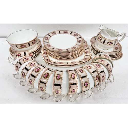 2282 - A Paragon tea set, early 1900s comprising of two cake plates, eleven small plates, twelve cups and s... 
