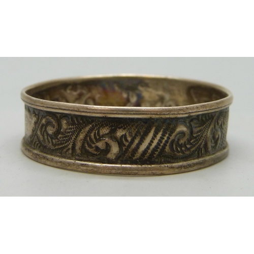 7027 - A silver matchbox case, a/f, a silver napkin ring, and a silver and enamel fob, 1907, cased, 23g tot... 