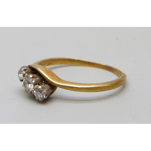 7038 - An 18ct gold and platinum three stone diamond ring, 2.2g, O/P