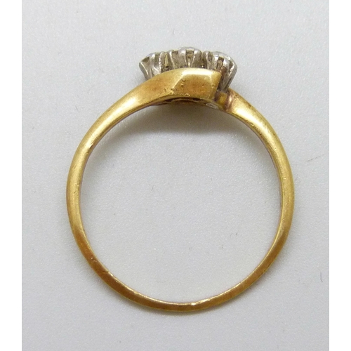 7038 - An 18ct gold and platinum three stone diamond ring, 2.2g, O/P