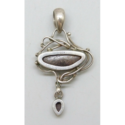 7046 - An Arts & Crafts silver and opal pendant, 4.5cm including bail