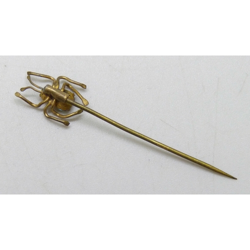 7054 - A Czech saphiret set spider stick pin, 4.2cm