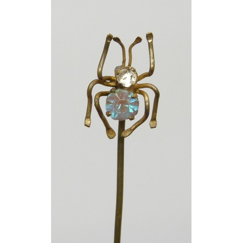 7054 - A Czech saphiret set spider stick pin, 4.2cm