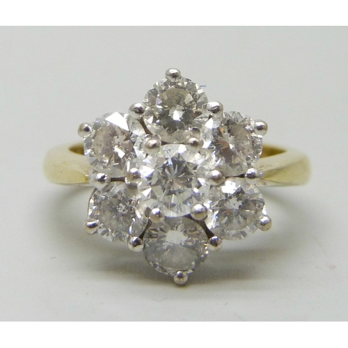 7139 - An 18ct gold seven stone diamond cluster ring, approximately 2ct total diamond weight, with purchase...