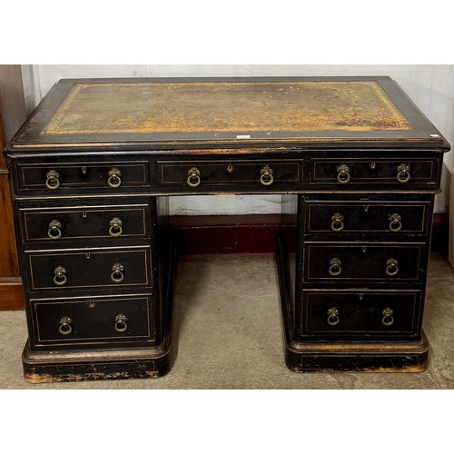 129 - A Victorian Aesthetic Movement ebonised and green leather topped pedestal desk