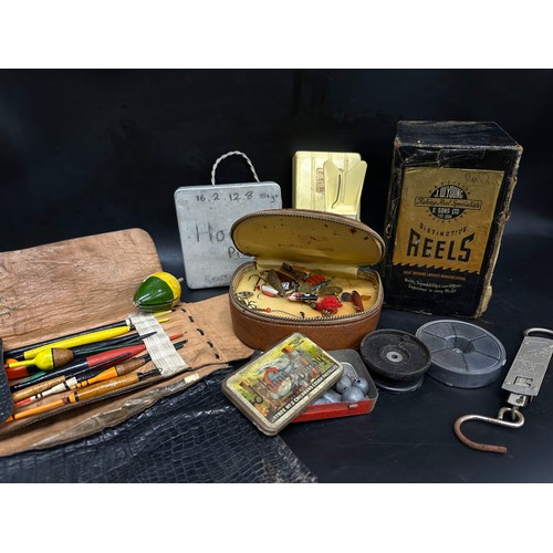 2275 - A collection of vintage fishing gear to include two rods, J W Young fishing reel, fishing hooks, flo... 