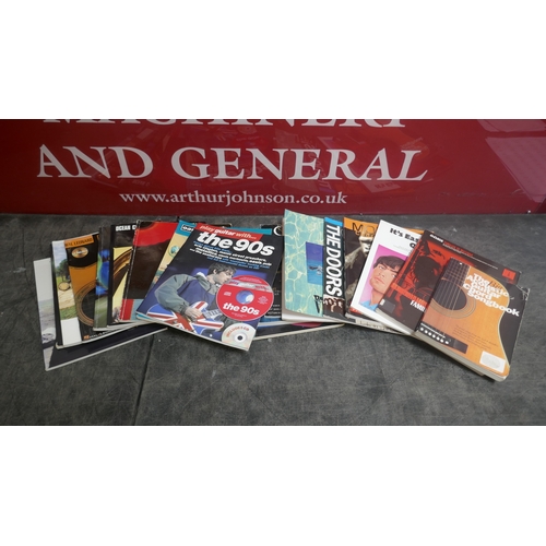 5019 - A large quantity of guitar books and a guitar bag