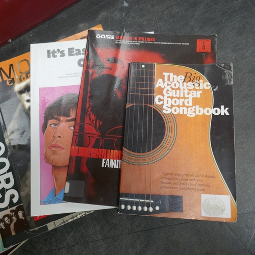 5019 - A large quantity of guitar books and a guitar bag