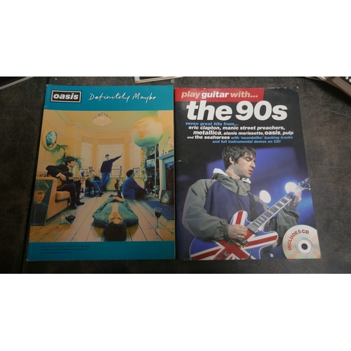 5019 - A large quantity of guitar books and a guitar bag