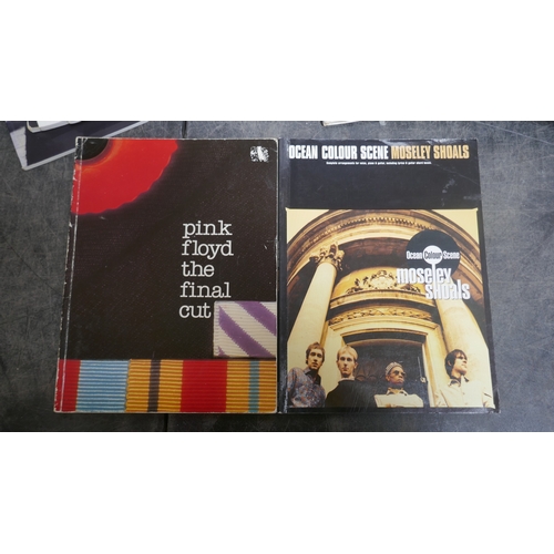 5019 - A large quantity of guitar books and a guitar bag