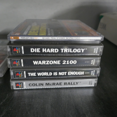 5044 - A Playstation One games console with controller with 4 games - Die Hard Trilogy, Warzone 2100, 007 T... 