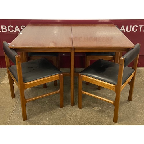 62 - A McIntosh teak extending dining table and four 9943 model chairs