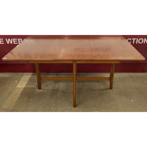 62 - A McIntosh teak extending dining table and four 9943 model chairs