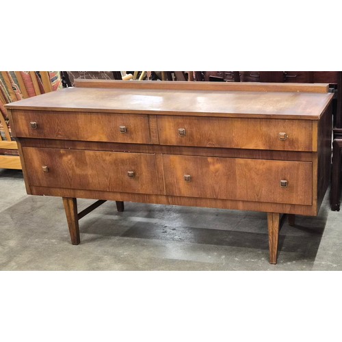 65 - A teak four drawer sideboard