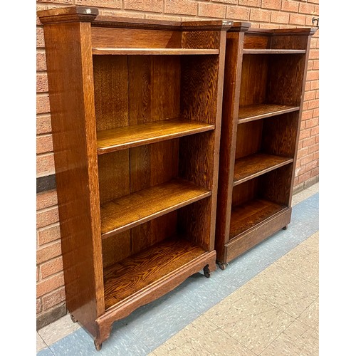 90 - A pair of Arts and Crafts oak open bookcases