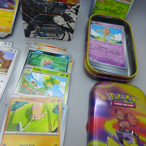 2228 - A large collection of Pokémon cards in collectors tin containing over 630 cards including a quantity... 