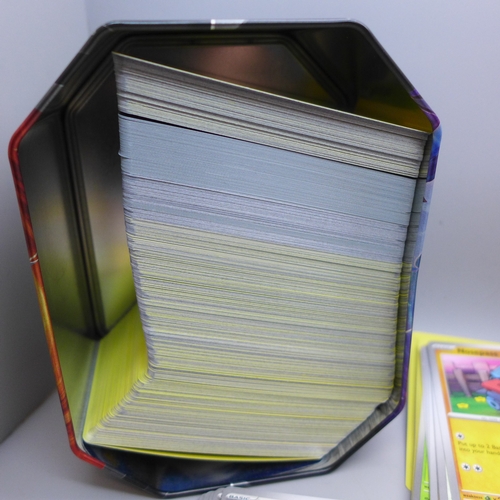 2228 - A large collection of Pokémon cards in collectors tin containing over 630 cards including a quantity... 