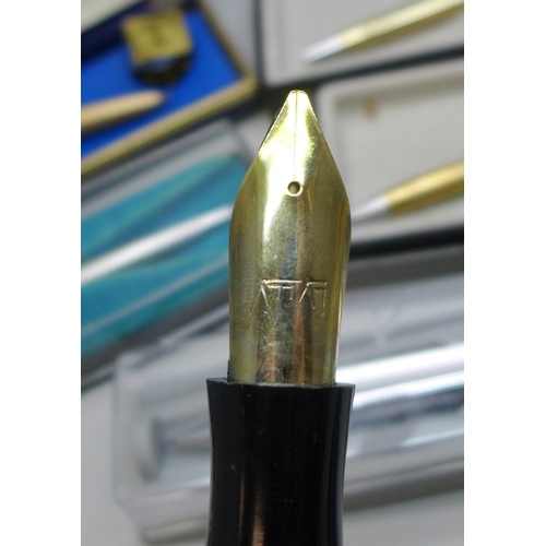 2233 - A collection of assorted pens to include Parker with 14ct gold nib and two rolled gold pens, etc.