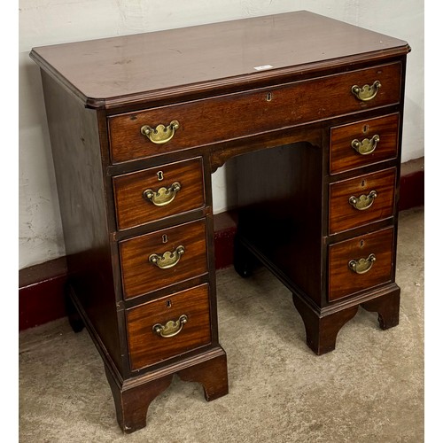 87 - A George II mahogany kneehole desk