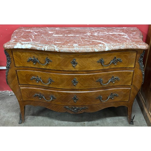 104 - A French Louis XV style inlaid kingwood, walnut, rouge marble topped and ormolu mounted bombe shaped... 