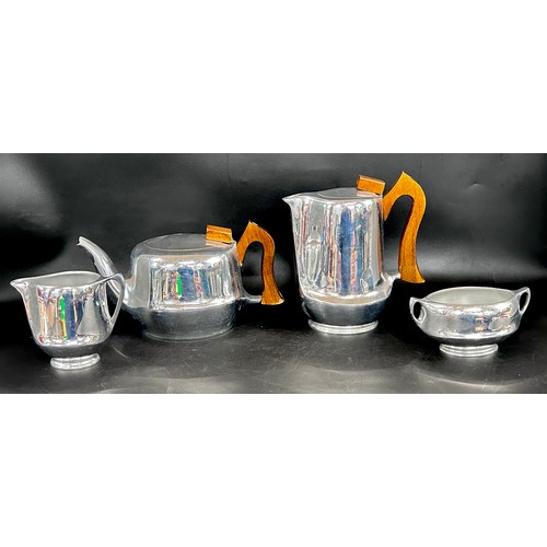 2288 - A four piece 20th Century Picquot Ware tea service comprising of two pots, milk jug and bowl