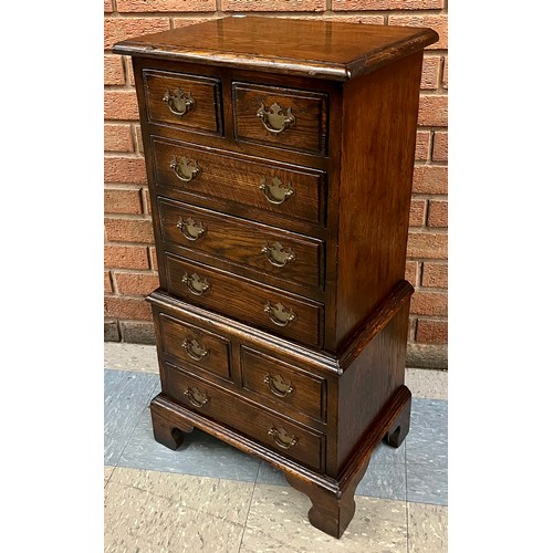 105 - A small George III style Ipswich oak chest on chest