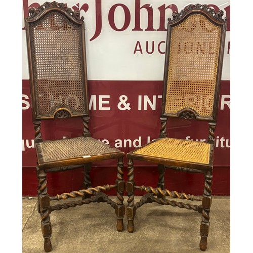 86 - A pair of early 20th Century Carolean Revival carved walnut side chairs