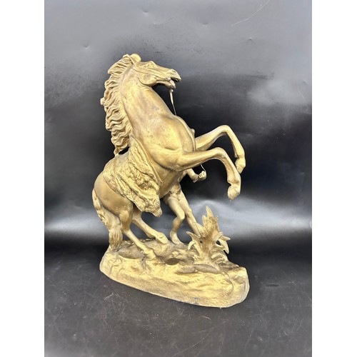 2284 - A spelter gilt painted figure of a horse with handler, approx. 40cm h