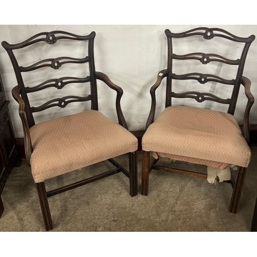 102 - A pair of George III oak elbow chairs