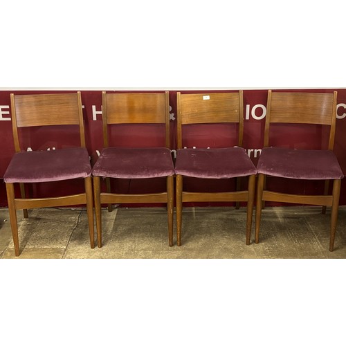 71 - A set of four teak dining chairs