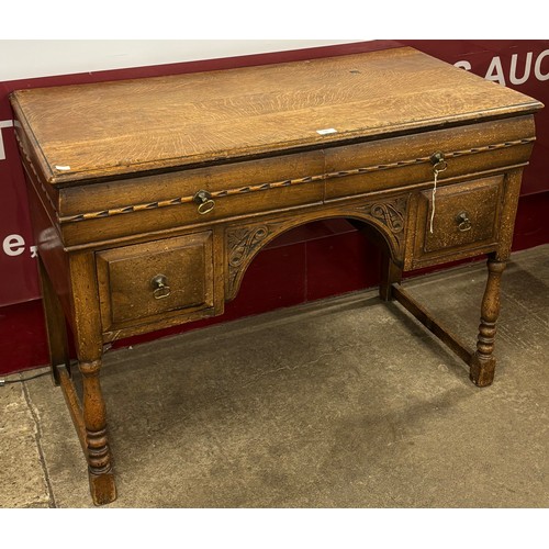 140 - A 17th Century style oak desk