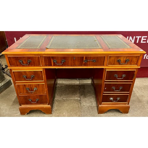 170 - A Regency style yew wood and leather topped pedestal desk and chair
