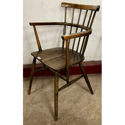 95A - A 19th Century style primitive oak comb back Windsor chair