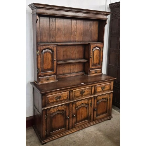 82 - A George III style Ipswich oak dresser, manner of Titchmarsh & Goodwin