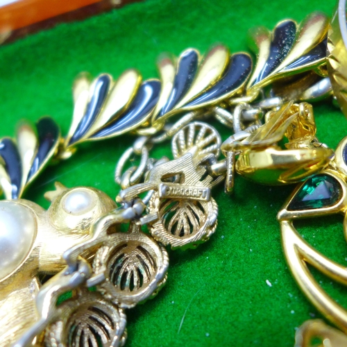 7137 - A collection of gold tone costume jewellery including Trifari, Napier, Monet, Corocraft, etc.