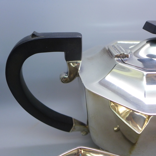 7143 - A George VI silver three piece tea service - tea pot, milk jug and sugar bowl, Sheffield, 1946, 1124... 