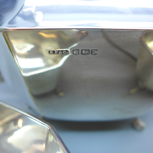 7143 - A George VI silver three piece tea service - tea pot, milk jug and sugar bowl, Sheffield, 1946, 1124... 