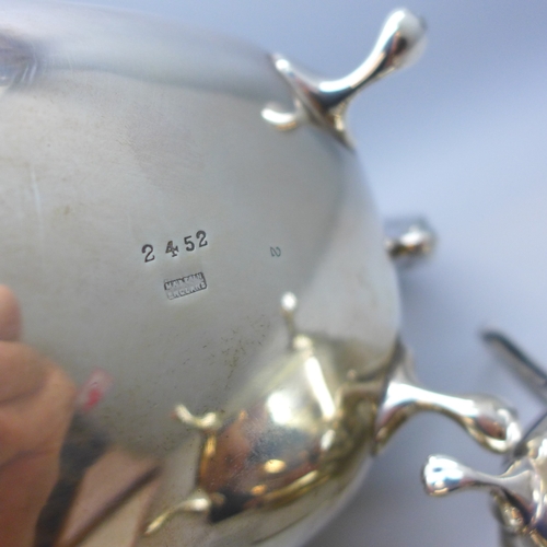 7143 - A George VI silver three piece tea service - tea pot, milk jug and sugar bowl, Sheffield, 1946, 1124... 