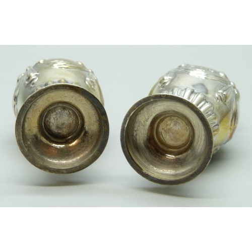 7130 - A Victorian silver salt and pepper with swag and bow design, Birmingham 1899 and 1900, 34g, 7.2cm, c... 
