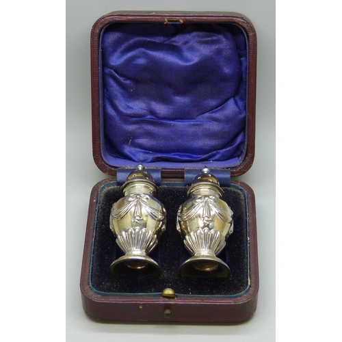 7130 - A Victorian silver salt and pepper with swag and bow design, Birmingham 1899 and 1900, 34g, 7.2cm, c... 