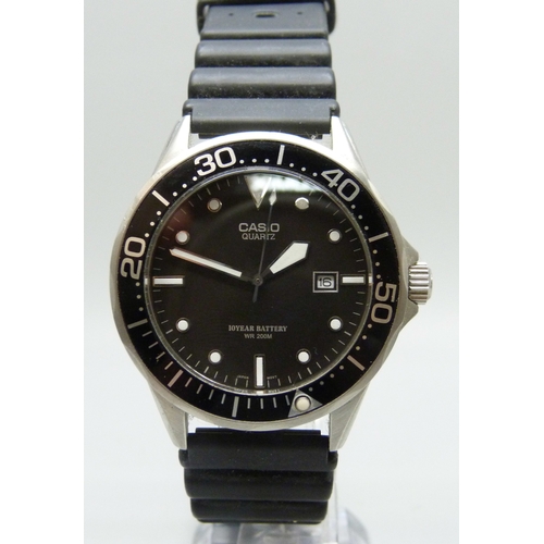7144 - A Casio WR200M wristwatch with black dial and date aperture, 44mm including crown